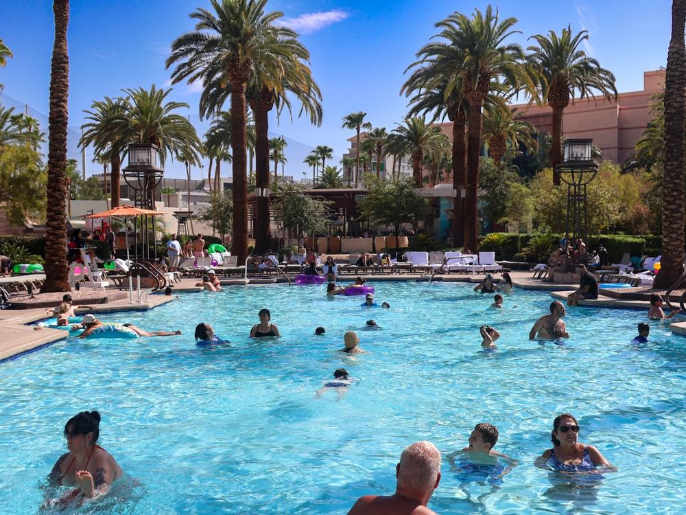 A Las Vegas resort pool lined with palm trees